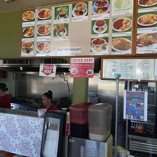 a restaurant counter with menus