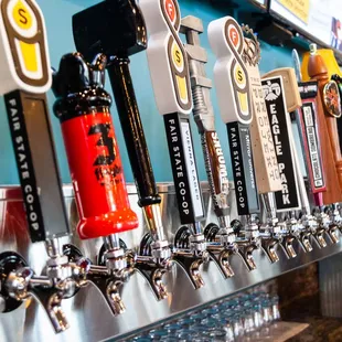 a row of beer taps