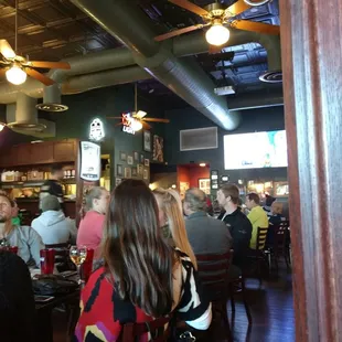 Shot of one side of the bar. Pats game is on in the background.