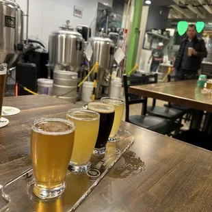 a row of beer glasses on a table