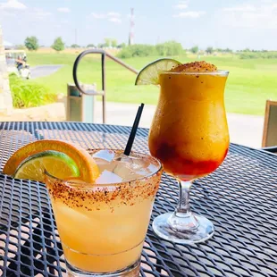two cocktails on a table