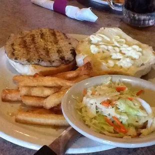 Pork chop sandwich, fries and coleslaw
