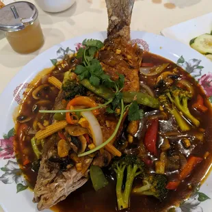 Ca Chien Ho Nam....Deep fried whole fish topped w/ light vegetables in a Hunan sauce.