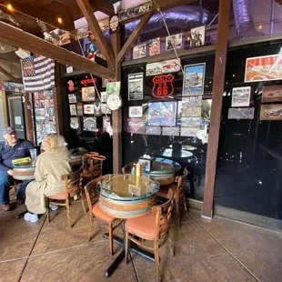 people sitting at tables in a restaurant