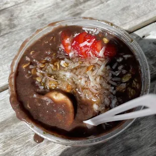 a chocolate pudding with strawberries and nuts