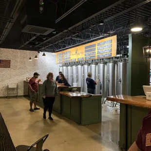 a man standing in front of a bar