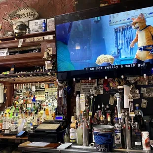 The bar and TV at Three Legged Dog Tavern