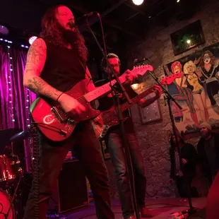 a man playing a guitar