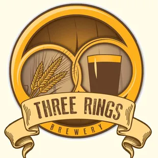 two glasses of beer and a barrel of wheat