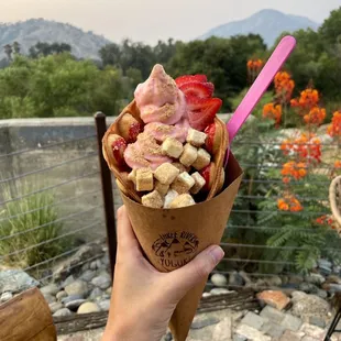 Strawberry frozen yogurt in bubble cone