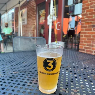 a pint of beer on a table
