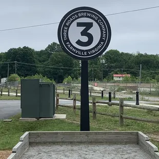 a sign for three roads brewing