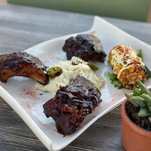 BBQ-Ribs  Slow Cooked with banana leaves/ jalapeno mashed potatoes, corn on the cob