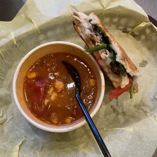 a bowl of soup and a sandwich