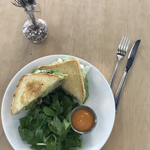 Chicken Salad sandwich on sourdough with greens and house dressing