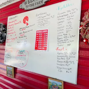 a whiteboard on a red wall