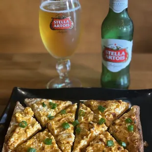 Buffalo chicken flatbread with green onion and crumbled blue cheese