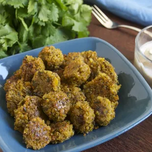 Falafel dough is a thick puree of sprouted chickpeas, onions, garlic, parsley, and mild but flavorful spices.