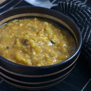 Chicken &amp; Rice in a Brazilian Coconut sauce-seasoned with ginger and garlic, mildly spiced, and rich with a tomato and coconut milk sauce.