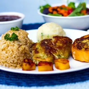 a plate of food and a bowl of salad