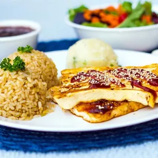 a plate of food and a bowl of rice