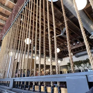 a bar with rope hanging from the ceiling