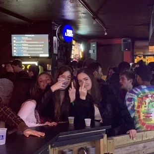 a group of people at a bar