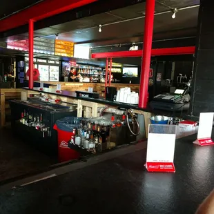 an empty bar with a can of soda