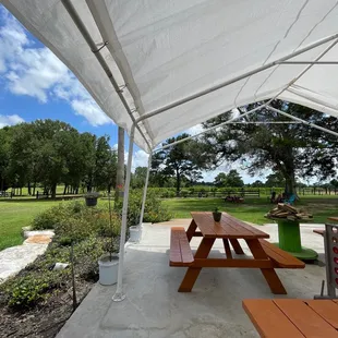 a picnic table under a tent