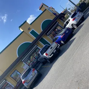 cars parked in front of a store