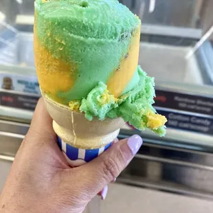 Single Scoop of Rainbow Sherbert on a Cake Cone