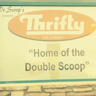 a sign in front of a store