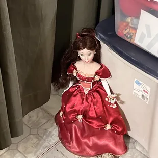 Very cute doll in a red beautiful gown