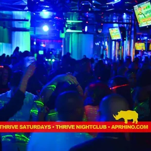 a large group of people in a nightclub