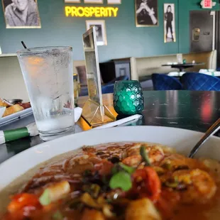 a bowl of soup and a glass of water