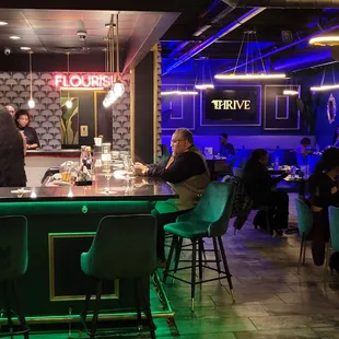 people sitting at the bar