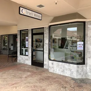 In the SW corner of the Pavilion West shopping center near the fountain.