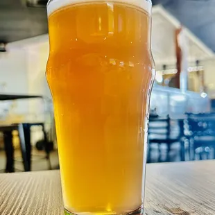 a glass of beer on a table