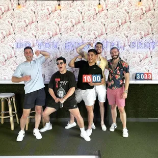A group of guests enjoying Football Bowling. It&apos;s truly a sport as unique as our venue!
