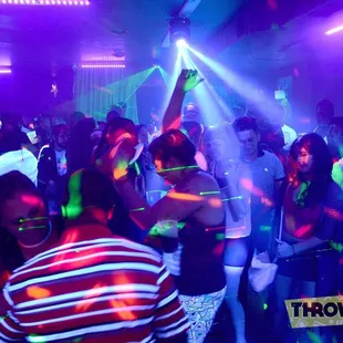 a group of people dancing at a party