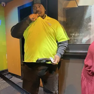 a man standing in front of a window