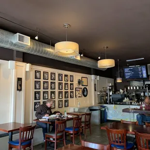 people sitting at tables in a coffeehouse