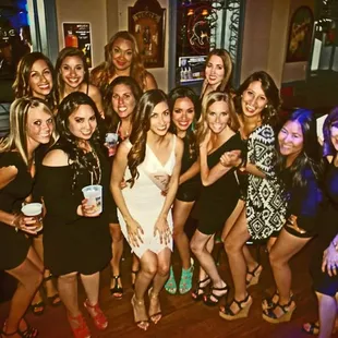 a group of women posing for a picture