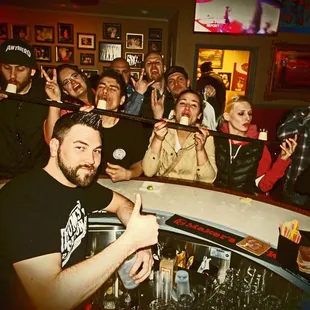 a group of people at a bar