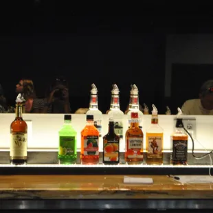 bottles of alcohol on a bar counter