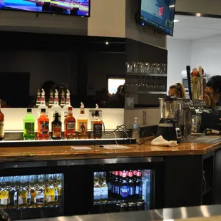 a bar with a bunch of bottles