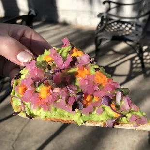 Incredible avocado toast with hot sauce and pickled onions