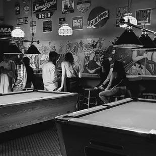 a man playing pool in a bar
