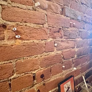 Sit in a booth and check the wall for short notes from previous customers