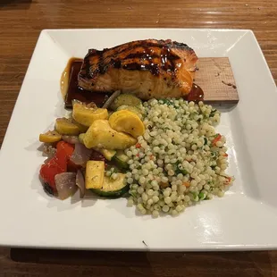 Cedar planked salmon with teriyaki, roasted vegetables and cous cous. Excellent!!